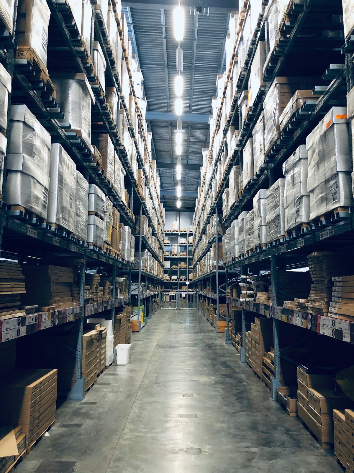 Warehouse aisle stacked with stock